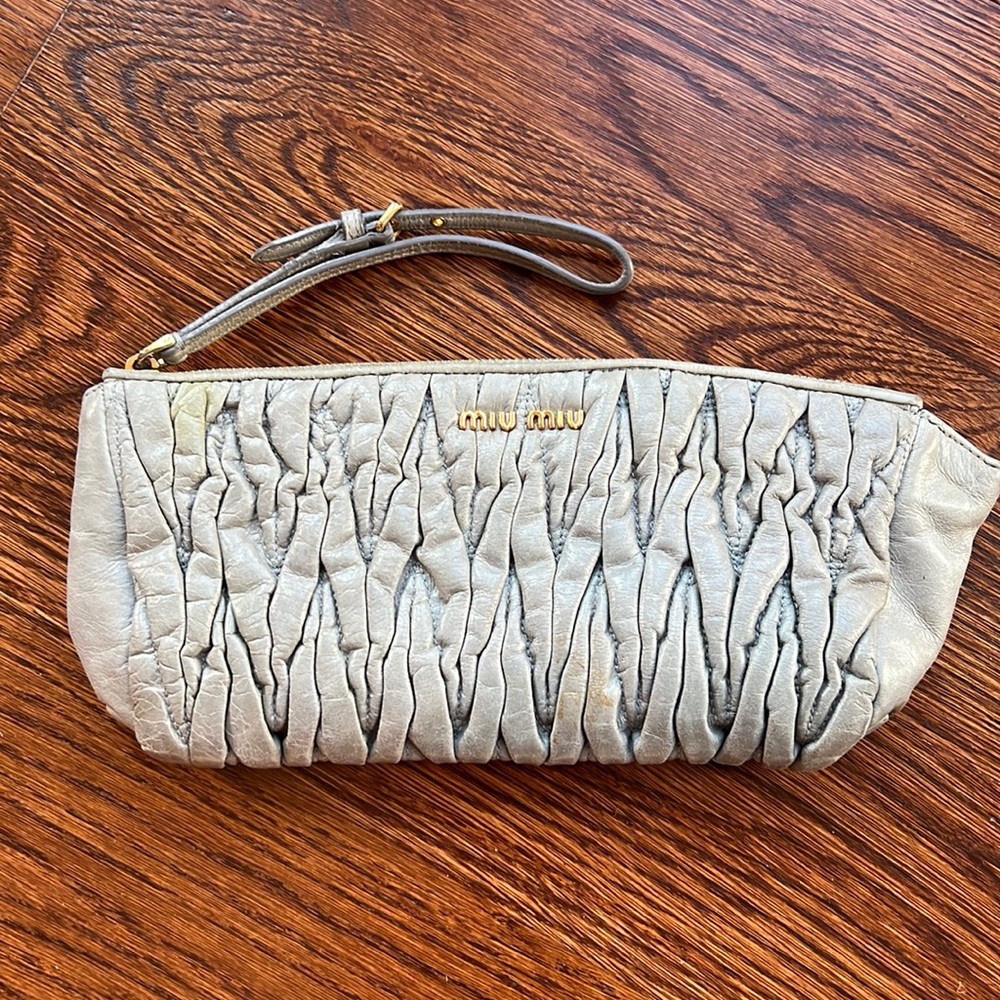 Miu miu wristlet. Gold accent.